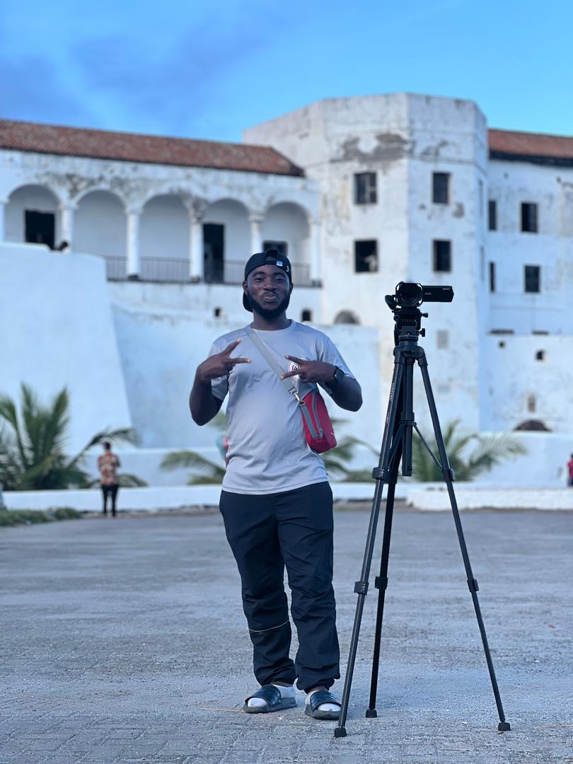 iwins student with camera on tripod at a historic castle